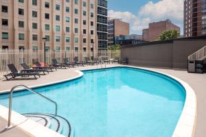 a large swimming pool on top of a building at DoubleTree by Hilton Silver Spring Washington DC North in Silver Spring