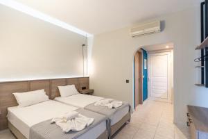 Voodi või voodid majutusasutuse Hera Zakynthos Hotel toas