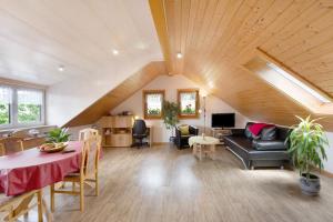 a living room with a couch and a table at Ferienwohnung Blasi mit Alpensicht in Ibach