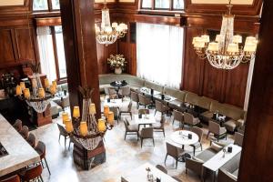 an overhead view of a restaurant with tables and chairs at The Benson Portland, Curio Collection by Hilton in Portland