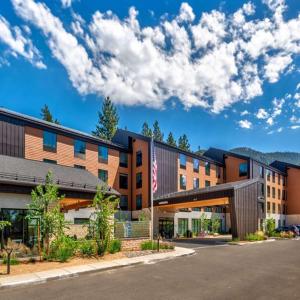 an exterior view of a building with a flag at Hampton Inn & Suites South Lake Tahoe in South Lake Tahoe