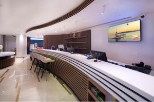 a bar in an office with a long counter at Hampton By Hilton Istanbul Old City in Istanbul