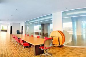 a conference room with a long table and red chairs at Lovina 20-12A Formosa Residence in Nagoya +18 photos