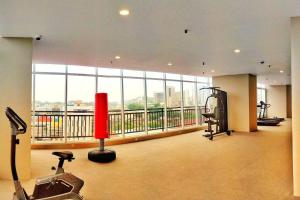 a large room with a large window and a gym at Lovina 20-12A Formosa Residence in Nagoya