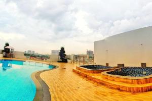 a large swimming pool on the roof of a building at Lovina 20-12A Formosa Residence in Nagoya