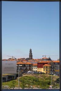 a view of a city with buildings and a clock tower at Se Catedral Hotel Porto, Tapestry Collection By Hilton in Porto
