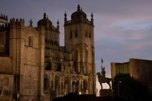 a building with a statue of a horse in front of it at Se Catedral Hotel Porto, Tapestry Collection By Hilton in Porto