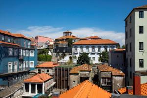 a group of buildings with orange roofs at Se Catedral Hotel Porto, Tapestry Collection By Hilton in Porto