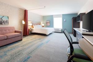 a hotel room with a bed and a couch at Home2 Suites By Hilton Richmond Short Pump in Richmond +28 photos