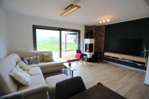 Χώρος καθιστικού στο Eifelvilla zur Kirsche - Wellness und Spa