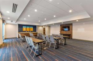 a conference room with tables and chairs and a podium at Hampton Inn Colorado Springs Northeast in Colorado Springs
