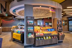 a grocery store aisle with a display of food at Tru By Hilton San Antonio At The Rim, Tx in San Antonio