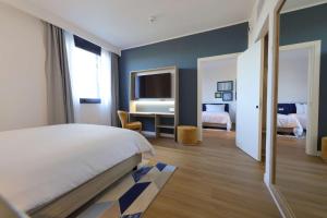Hampton by Hilton Rome North Fiano Romano客房内的一张或多张床位