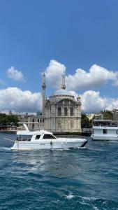 two boats in the water in front of a building at DIAMOND YACHT in Istanbul
