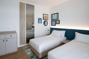 Hampton by Hilton Rome North Fiano Romano客房内的一张或多张床位