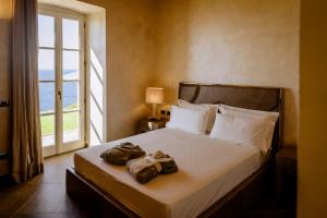 Postel nebo postele na pokoji v ubytování Resort Faro di Punta Fenaio
