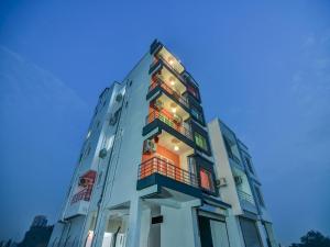 a tall building with balconies on the side of it at OYO Home Designer Stay Hinjewadi in Hinjewadi