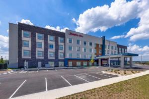 a rendering of a hotel with a parking lot at Hampton Inn Kansas City Southeast, Mo in Kansas City