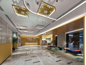 a lobby of a hotel with couches and a waiting room at Hilton Garden Inn Lhasa in Lhasa