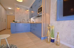 Kuchnia lub aneks kuchenny w obiekcie Sunset Apartments - Kormoran - Plaża 300m