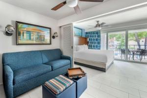 a living room with a couch and a bed at Hilton Vacation Club Flamingo Beach Sint Maarten in Simpson Bay