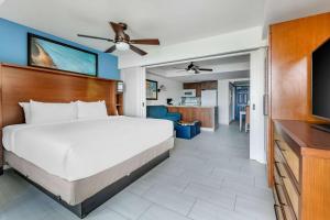 a bedroom with a bed and a flat screen tv at Hilton Vacation Club Flamingo Beach Sint Maarten in Simpson Bay