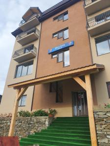 a building with a sign on the front of it at Cabana Bella Vista in Ranca