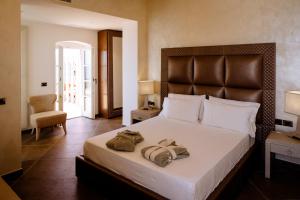 Postel nebo postele na pokoji v ubytování Resort Faro di Punta Fenaio