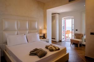 Postel nebo postele na pokoji v ubytování Resort Faro di Punta Fenaio