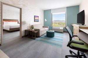 a rendering of a hotel room with a bed and a desk at Home2 Suites By Hilton North Scottsdale Near Mayo Clinic in Scottsdale