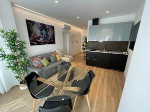 a living room with a couch and a table at Apartamentos TriBeCa Centro I in Albacete