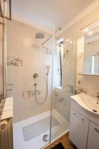 a bathroom with a shower and a sink at Apartment Vanda in Matulji