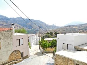 a view of a city with mountains in the background at Serene, slow living house in Orné