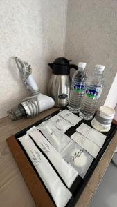 a tray with napkins and water bottles on a table at Feng Chia Hygge in Taichung
