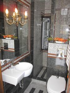 a bathroom with a sink and a toilet at Zrínyi ház in Szántód +16 photos