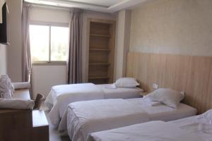 Voodi või voodid majutusasutuse HOTEL CAFE PALAIS SALAM , Beni Mellal toas