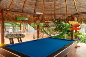 a pool table in front of a pavilion with a pool table at El Arca de Pachue in Punta Chame