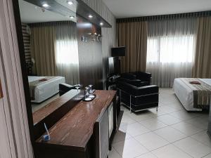 Postel nebo postele na pokoji v ubytování Green Hotel Ninfa