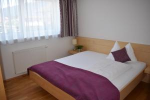 Una cama o camas en una habitación de Hotel Kleißl