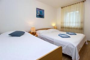 Posteľ alebo postele v izbe v ubytovaní Apartments Marlen