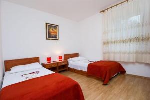 Posteľ alebo postele v izbe v ubytovaní Apartments Marlen