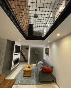 a living room with a couch and a table at Zara at Saint Raphael France in Saint-Raphaël