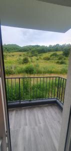 a balcony with a view of a field at meda's apartament in Floreşti