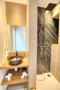 a bathroom with a sink and a shower at LimeSTAY - The Cannois T2 Modern WIFI in Cannes