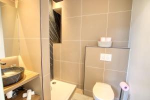a small bathroom with a toilet and a sink at LimeSTAY - The Cannois T2 Modern WIFI in Cannes