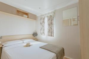 Posteľ alebo postele v izbe v ubytovaní Camping La Sirena