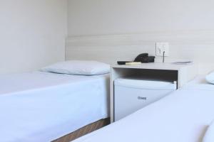 Postel nebo postele na pokoji v ubytování MFG Hotel