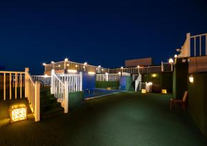 a view of a patio at night with lights at Golden Garden Al Corniche in Dammam