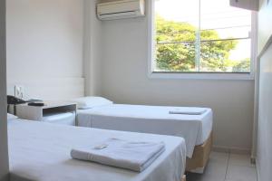 Postel nebo postele na pokoji v ubytování MFG Hotel