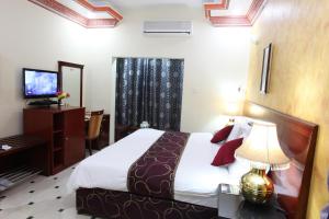 Voodi või voodid majutusasutuse Al Bahjah Hotel toas